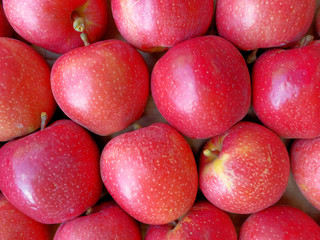 fresh juicy red apples top view closeup, natural background