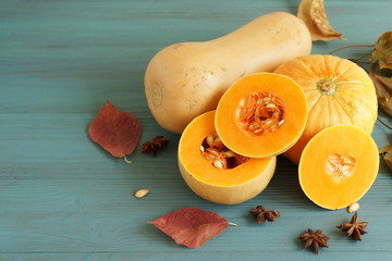 fresh pumpkin on blue wooden background closeup. copy space. top view