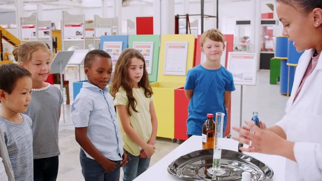 School kids watching an experiment at a science centre
