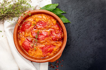 Peppers (del Piquillo) stuffed with meat or fish. Roasted red peppers and fillings made at home. Recipe of Spanish food and Mediterranean diet. With delicious sauce to spread bread.