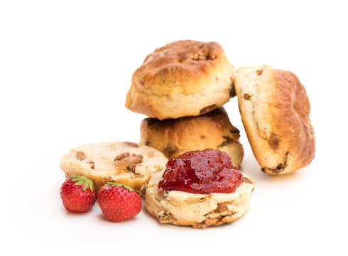 Traditional  scones with fresh strawberries and jam isolated on white