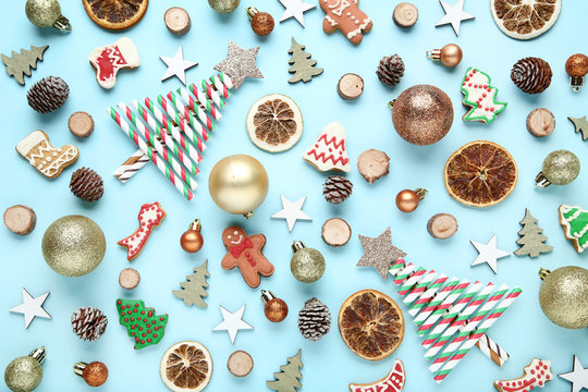 Different christmas decorations with gingerbread cookies on blue background
