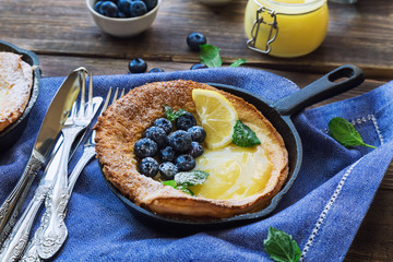 Dutch Baby pancake with lemon curd and blueberries