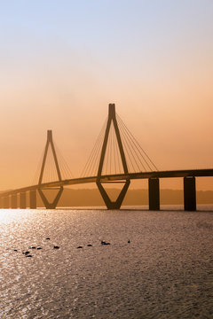 Fototapeta faro bridge in sunset light, the highway bridge over the Storstroem in denmark connects the islands and is a part of the vogelfluglinie (bird flight line), copy space