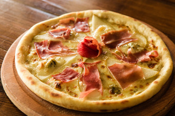 delicious pizza with meat, cheese and mushrooms	