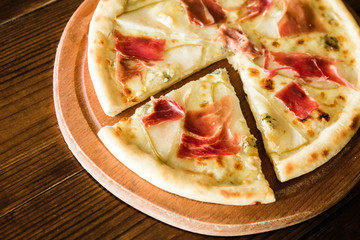 delicious pizza with meat, cheese and mushrooms	