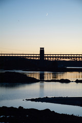 Britannia bridge tower and crescent moon over Anglesey