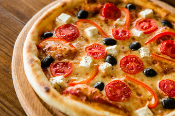 delicious pizza with meat, cheese and mushrooms	
