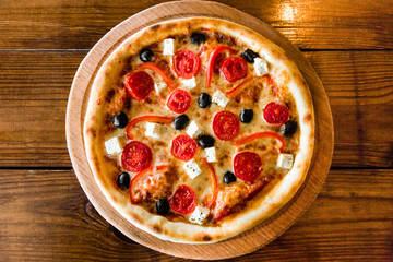 delicious pizza with meat, cheese and mushrooms	