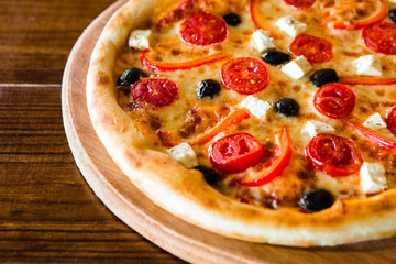 delicious pizza with meat, cheese and mushrooms	