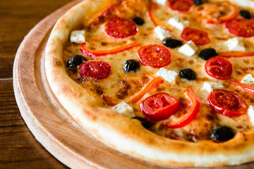 delicious pizza with meat, cheese and mushrooms	