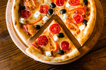 delicious pizza with meat, cheese and mushrooms	