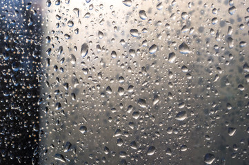 background of raindrops on window glass, close up