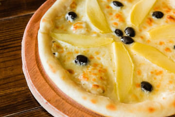 delicious pizza with meat, cheese and mushrooms	