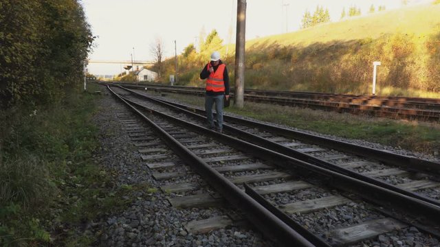 Railway Engineer  walk on railway rails