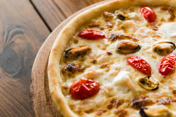 delicious pizza with meat, cheese and mushrooms	