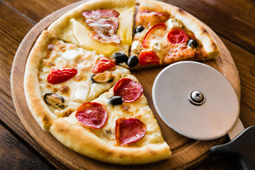 delicious pizza with meat, cheese and mushrooms	