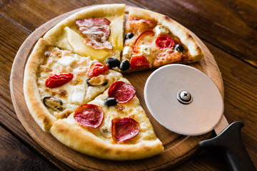 delicious pizza with meat, cheese and mushrooms	