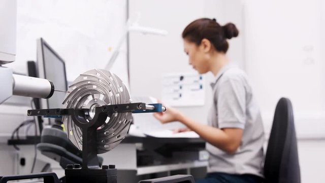 Female Engineer Uses CMM Coordinate Measuring Machine In Factory