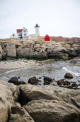Fototapeta na wymiar Portland Head Lighthouse in Portland Maine is one of Maine's most famous historical landmarks