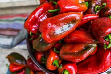 Close up of washed red pepper, preparation of canning, ripe peppers for baking, without nitrates. Shallow depth ot field. Concept Healthy Eating.