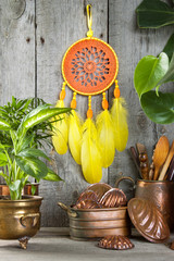 Orange yellow dream catcher on gray