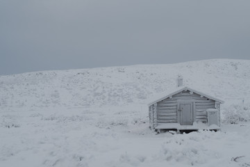 remote cottage in the snow