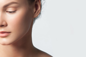 Fototapeta premium Young beautiful woman with clean perfect skin close-up