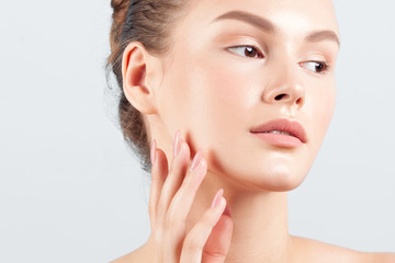 Fototapeta premium Young beautiful woman with clean perfect skin close-up