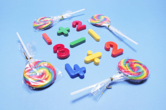 Lollipops with Plastic Numbers