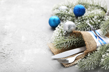 Kitchen cutlery with christmas decorations on wooden table © 5second