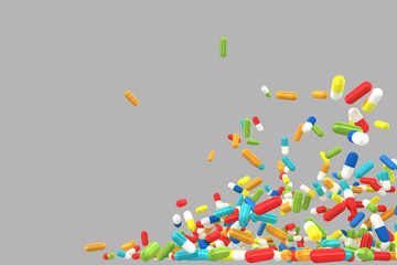 lots of crumbling and falling colored pills on gray background.  Isolated. 3d illustration