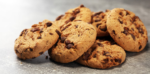 Chocolate cookies on rustic table. Chocolate chip cookies shot