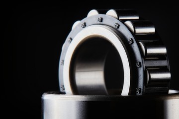 Close-up of a set of ball and roller bearings on a dark background