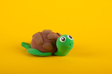 Cute turtle made of colored modelling clay