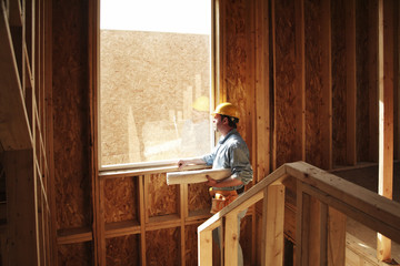 young man painting a wall