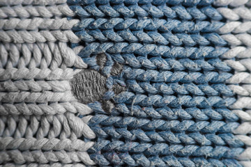 The texture of a knitted wool . Background