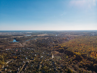 Aerial or top view of rural village in beautiful autumn nature landscape panorama