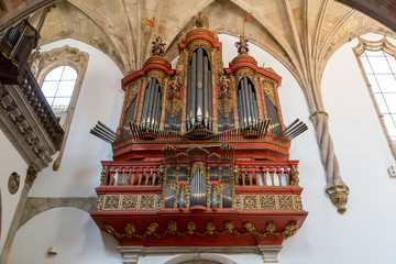 Coimbra, Portugal, August 11, 2017: Baroque pipe organ of the 18th century inside the Monastery of Santa Cruz.