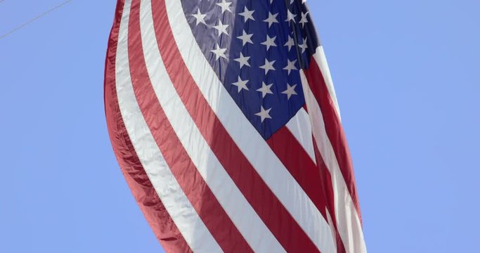 Close-up: American Flag Waving in the Sunlight (Shot on RED)