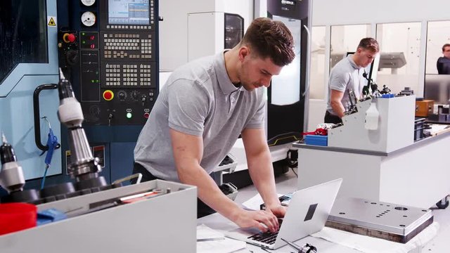 Male Engineer Using CAD Programming Software On Laptop