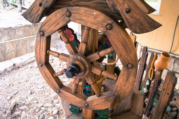 Wooden lever-wheel to lift the bucket from the well. © Natalia