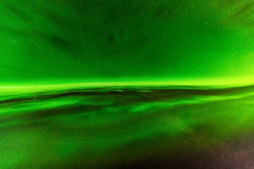 Close up high definition photo of very bright green aurora with stars shining behind it, taken in north Sweden, no clouds, very good for backgrounds