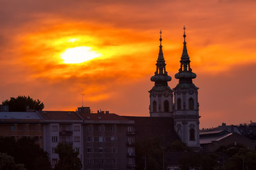 Fototapeta premium Sunset over the historical district and church in Budapest city, Hungary