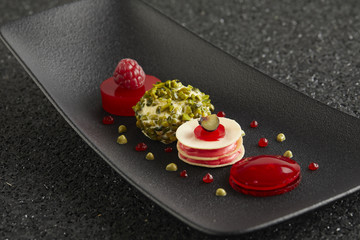 Raspberry dessert and pistachio