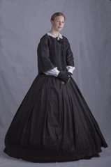 Victorian woman in black ensemble