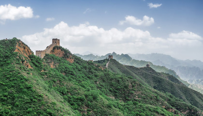 Fototapeta na wymiar The Great Wall Jinshanling section with green trees in a sunny day, Beijing, China