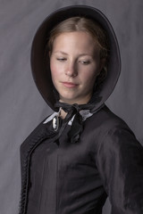 Victorian woman in black ensemble