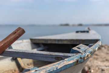 The detail of an old abandoned fishing boat left on the coast
