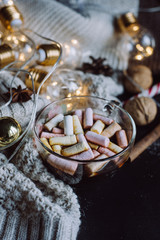 winter hot drinks.  New Year celebration dark flat lay with presents, tags, garlands and copy space on a dark wooden background.